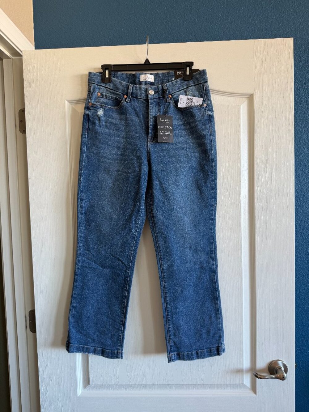 Nicole Miller distressed jeans.